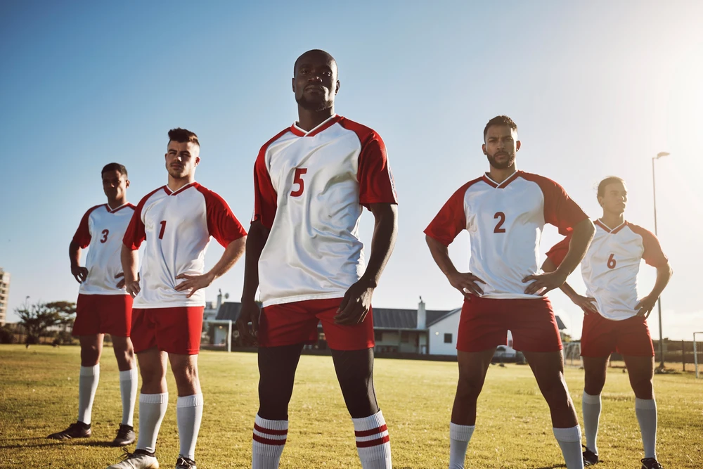 Soccer team players wearing custom sports jerseys made in Hamilton